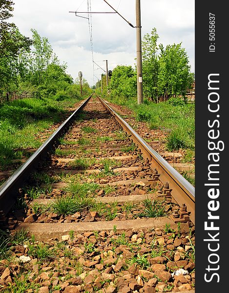 A horizontal shot of railroad tracks extending to the horizon.