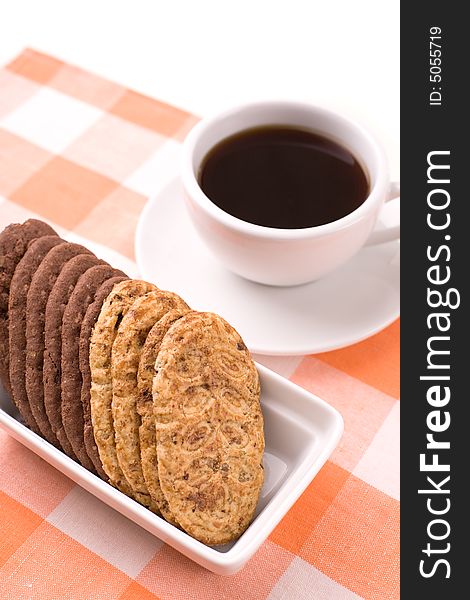 Cup of black coffee and cookies