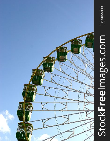 Giant Wheel detail isolated in blue sky background - in counter light -