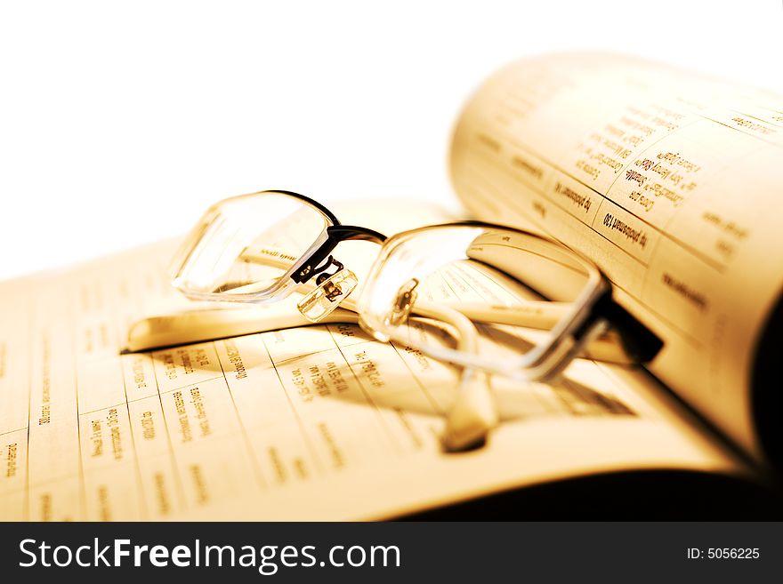 Book and Glasses on white.