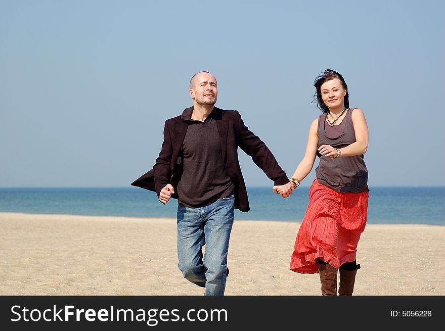 Happy and loving couple on the beach