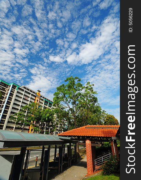 A peaceful neighborhood with clouds and blue skies