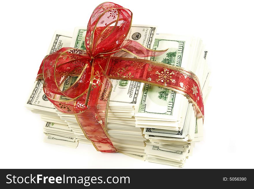 Stack of money wrapped in red bow and ribbon