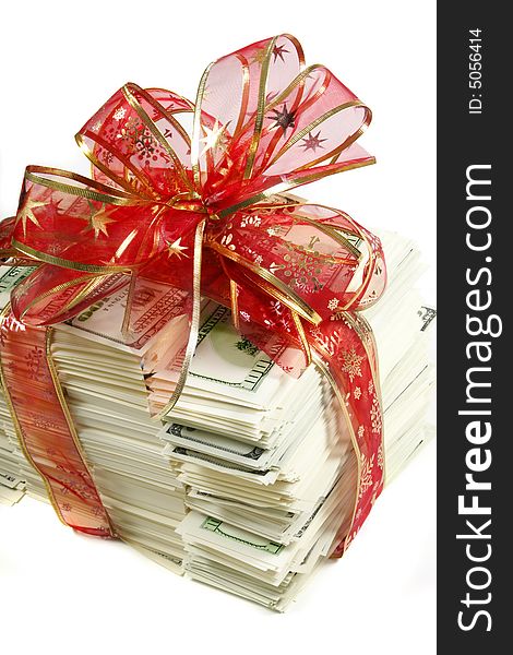 Stack of money wrapped in red bow and ribbon