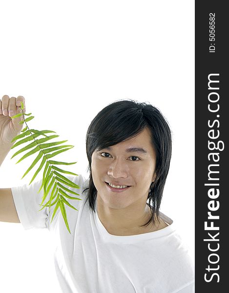 Young man on holding a small plant