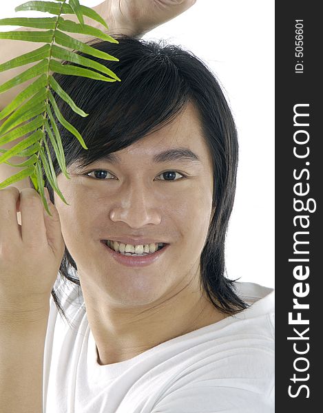 Young man on holding a small plant