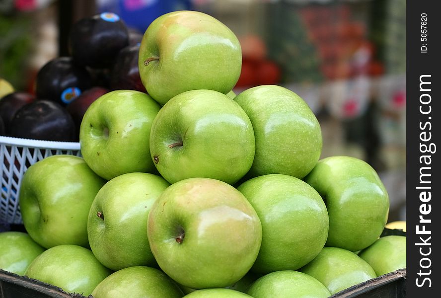 Green apples pyramid on a street market. Green apples pyramid on a street market