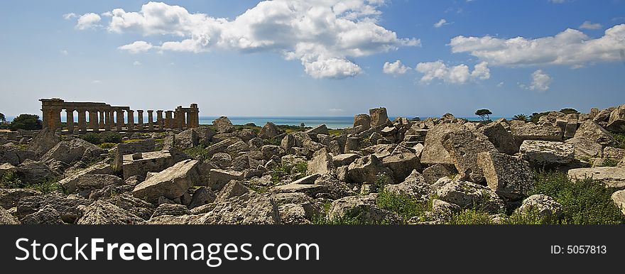 The archaeological park of Selinunte in the yellow flowers and Sea. The archaeological park of Selinunte in the yellow flowers and Sea