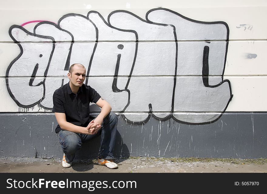 Man In Front Of A Graffiti Wall. Man In Front Of A Graffiti Wall