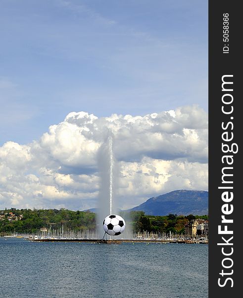 The famous Jet d'Eau fountain in Geneva with giant soccer. The famous Jet d'Eau fountain in Geneva with giant soccer