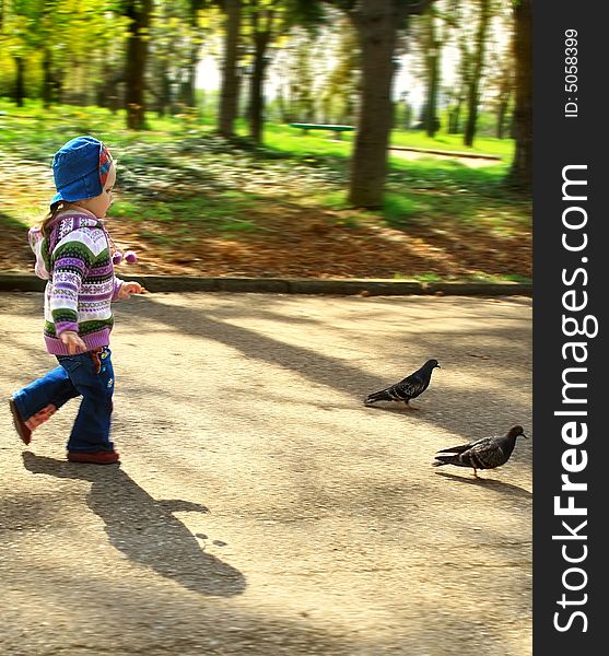 Portrait of the girl in the early spring walking in the street