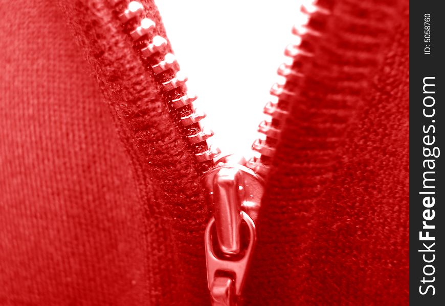 Zipper. Macro. Color clothes. Red and white.