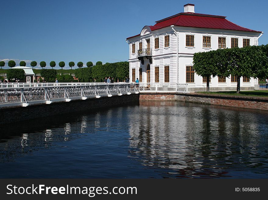 White building and the bridge to it. Russia. Peterhof. White building and the bridge to it. Russia. Peterhof