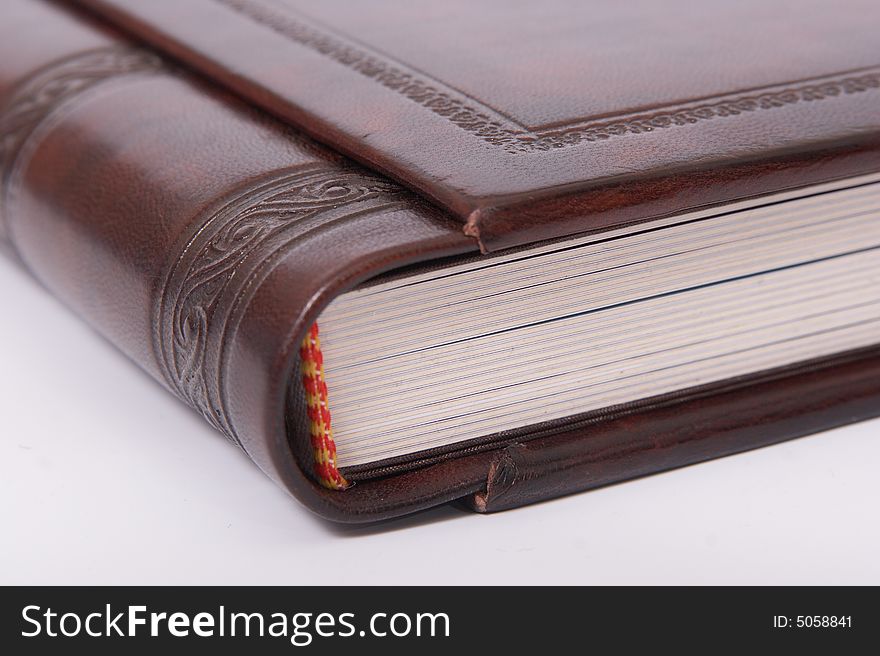 The photobook with a cover from a natural leather with a stamping