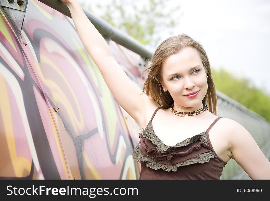 Young Lady Portrait. Graffiti covered tunnel in the background. Young Lady Portrait. Graffiti covered tunnel in the background.