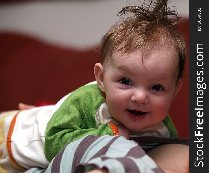 Four month old baby Julia lying on her mother. Four month old baby Julia lying on her mother