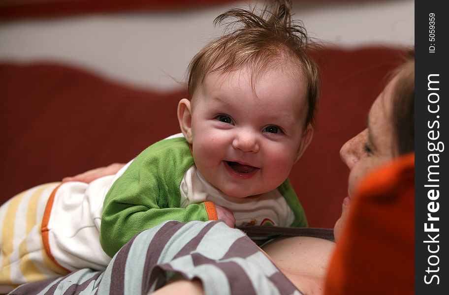 Four month old baby Julia lying on her mother. Four month old baby Julia lying on her mother