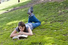 Young Woman Reading A Book Stock Photos
