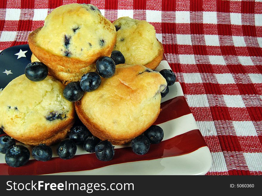 Fresh blueberry muffins on a flag plate. Fresh blueberry muffins on a flag plate.