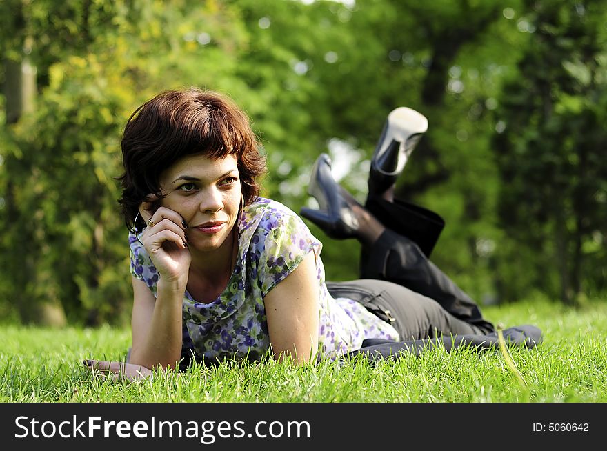 Young woman laid in grass. Young woman laid in grass