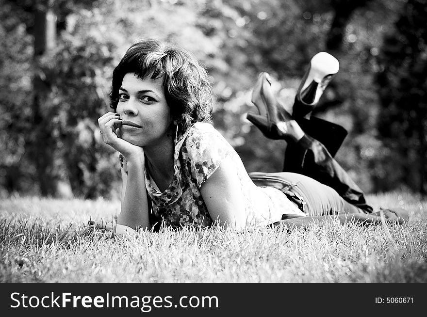 Young woman laid in grass