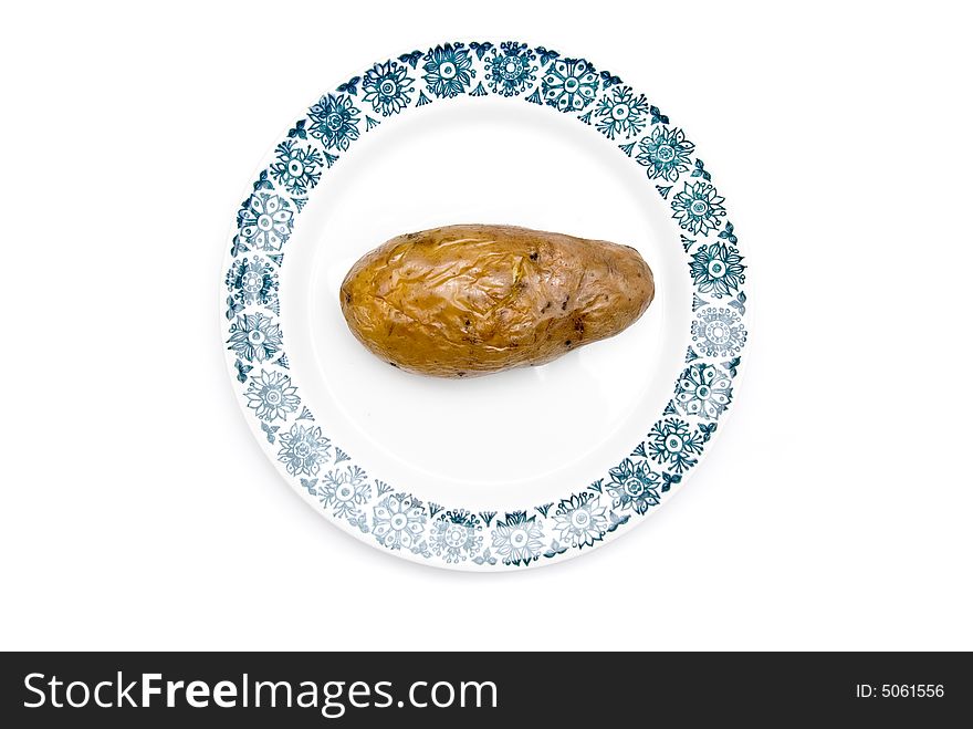 Potato on a plate, isolate on white