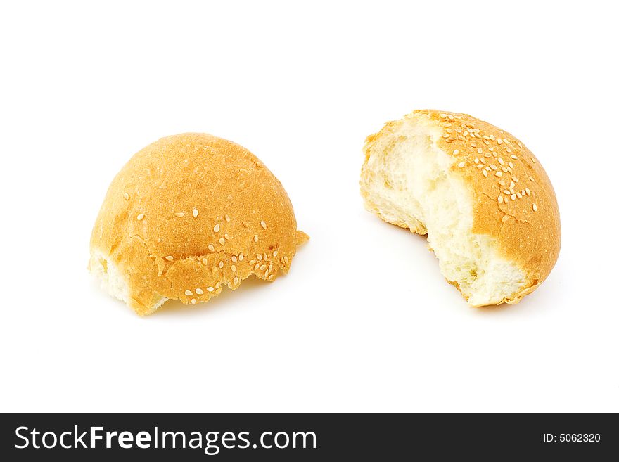 Isolated photo of a broken bun with sesame