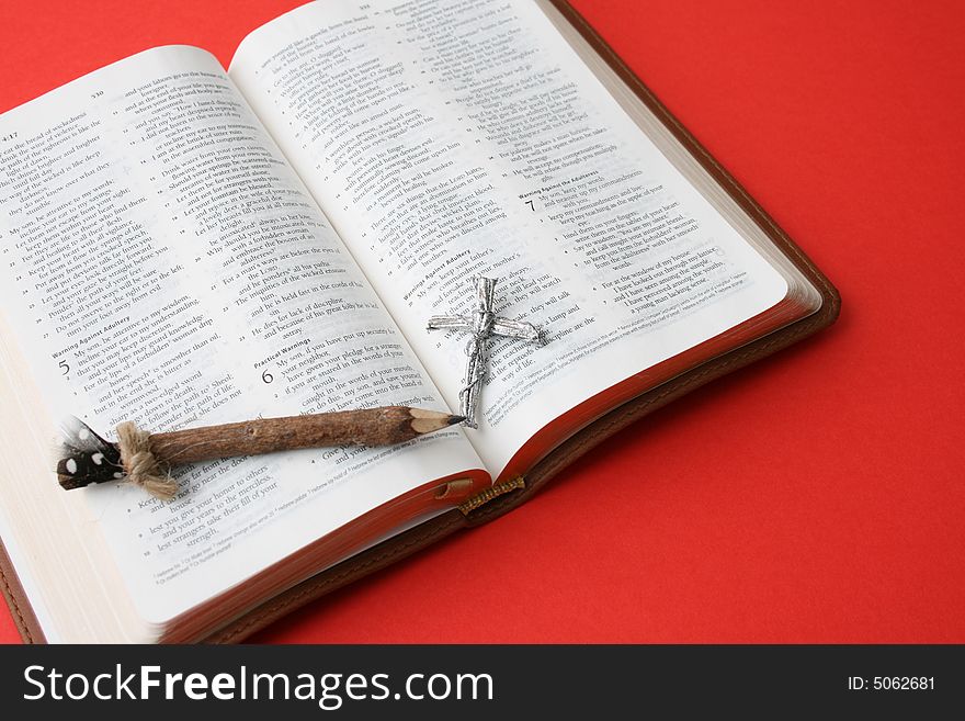 Leather bound bible opened at a piece of scripture