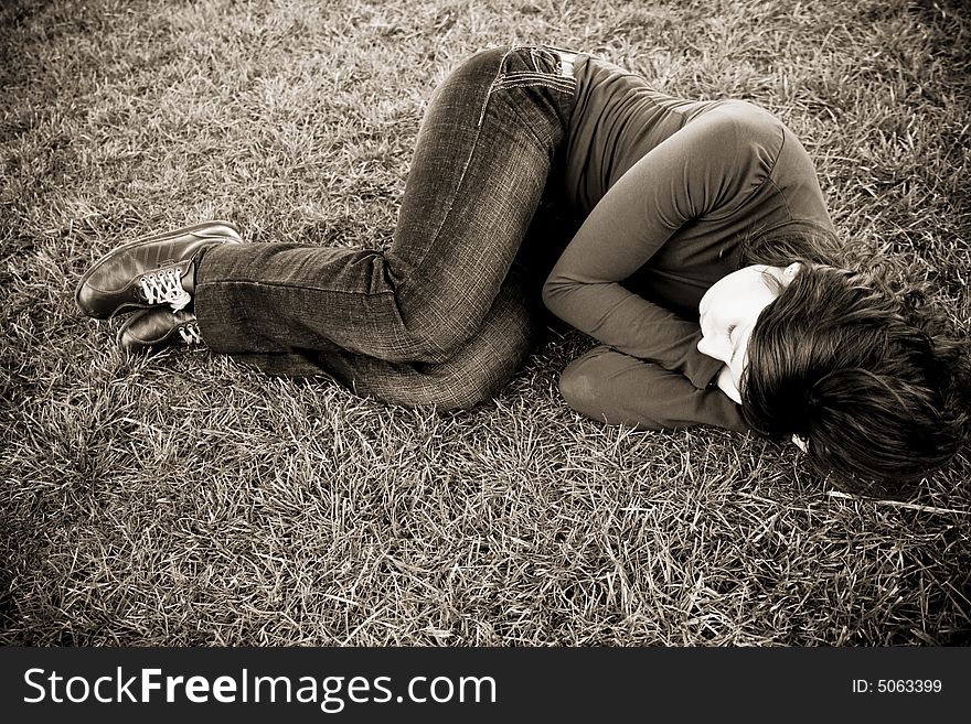 Young Woman On The Grass