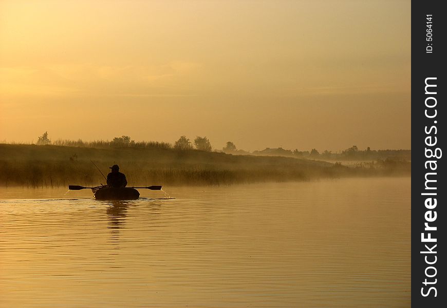 Early in the morning, the fisherman sails on boat. Early in the morning, the fisherman sails on boat