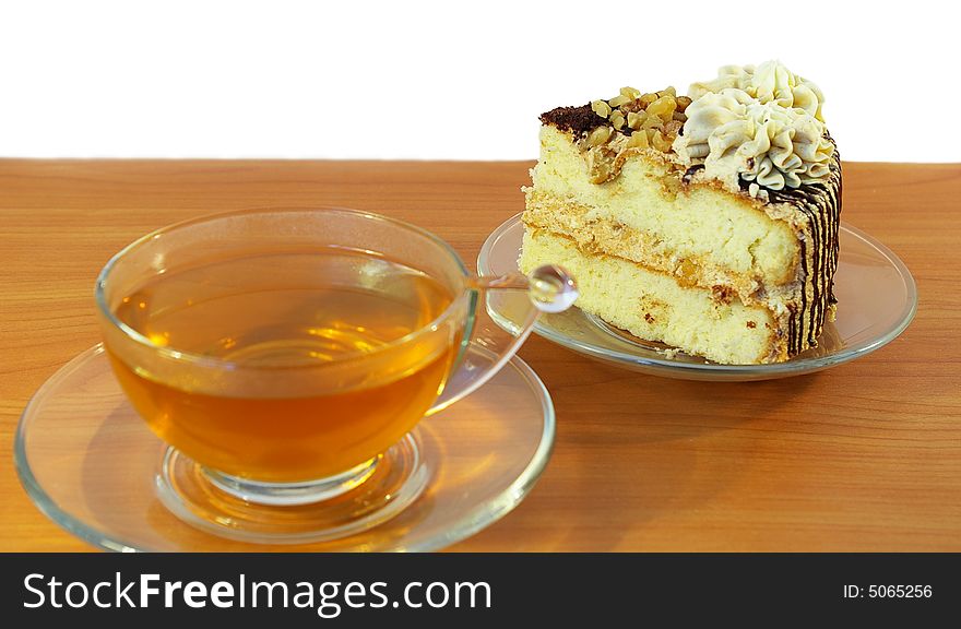 Cup of tea and cake isolated on white background. Cup of tea and cake isolated on white background