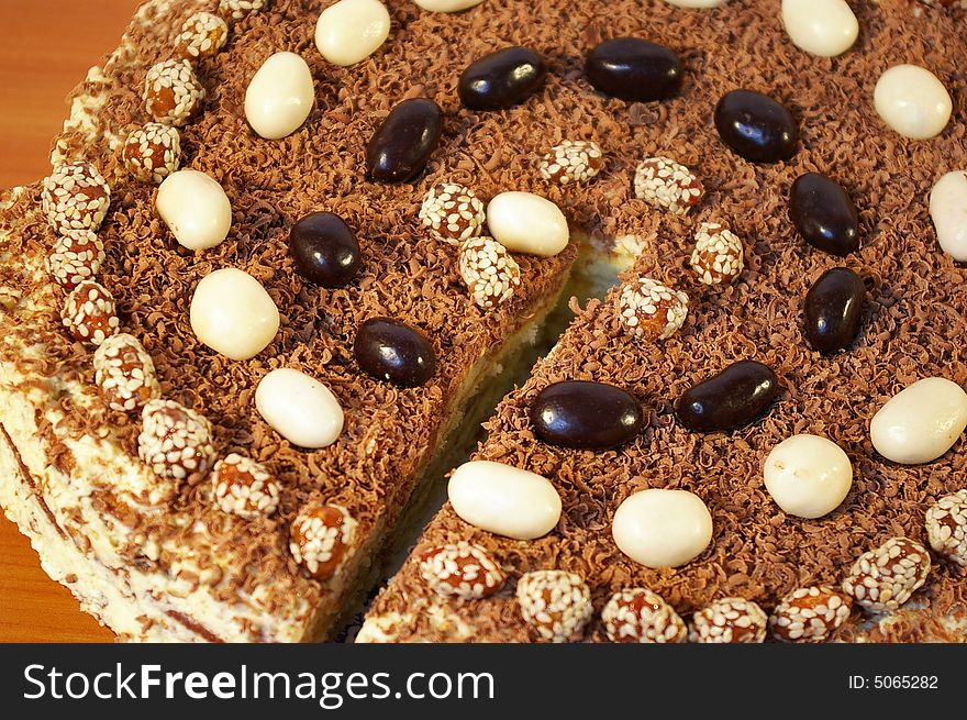 The celebratory ornate chocolate cake on a table