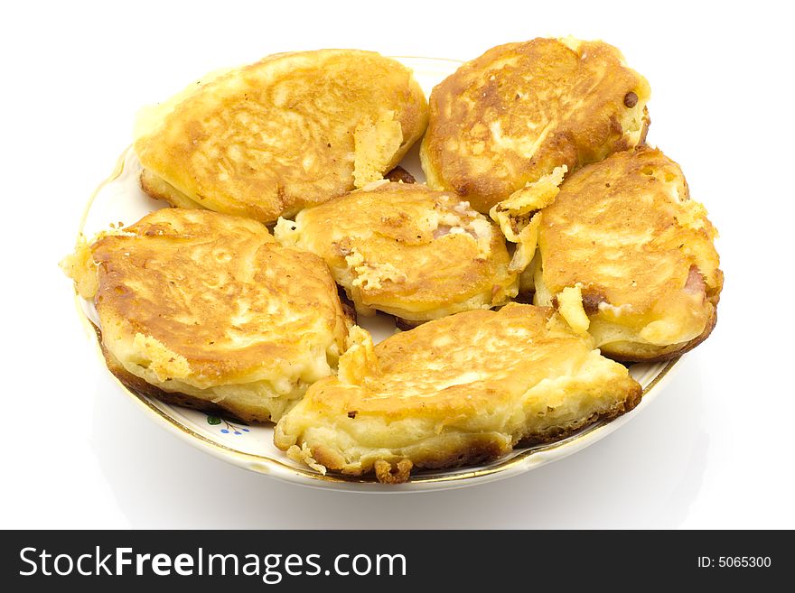 Plate of fresh pancakes with filling, isolated