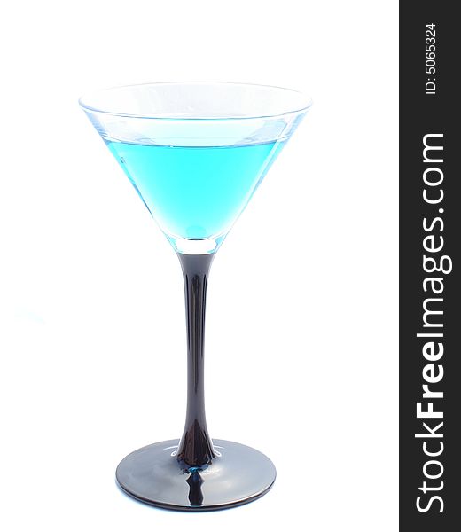 Blue curacao cocktail in a martini glass.