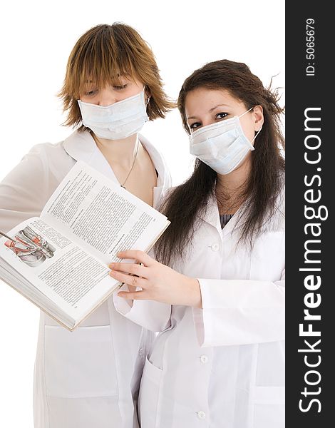 The two young attractive nurse with a documents isolated on a white background. The two young attractive nurse with a documents isolated on a white background