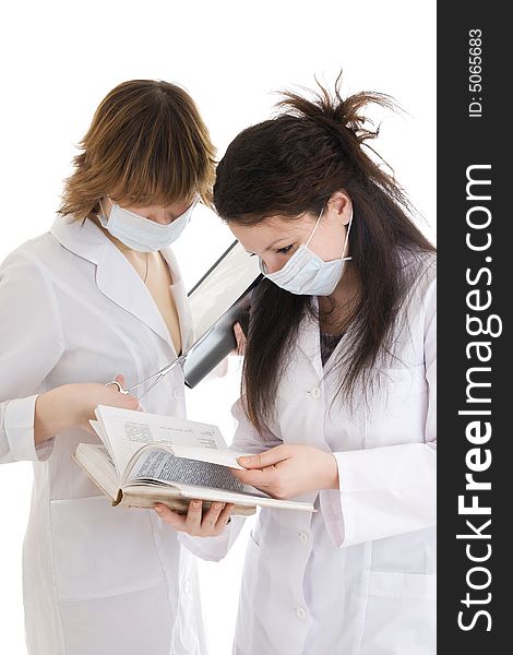 The two young attractive nurse with a documents isolated on a white background. The two young attractive nurse with a documents isolated on a white background