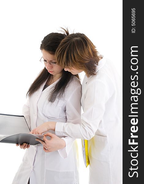 The two young attractive nurse with a folder isolated on a white background. The two young attractive nurse with a folder isolated on a white background