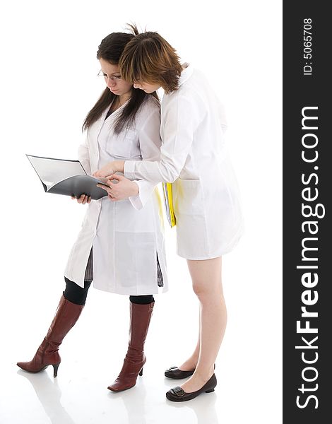 The two young attractive nurse with a folder isolated on a white background. The two young attractive nurse with a folder isolated on a white background