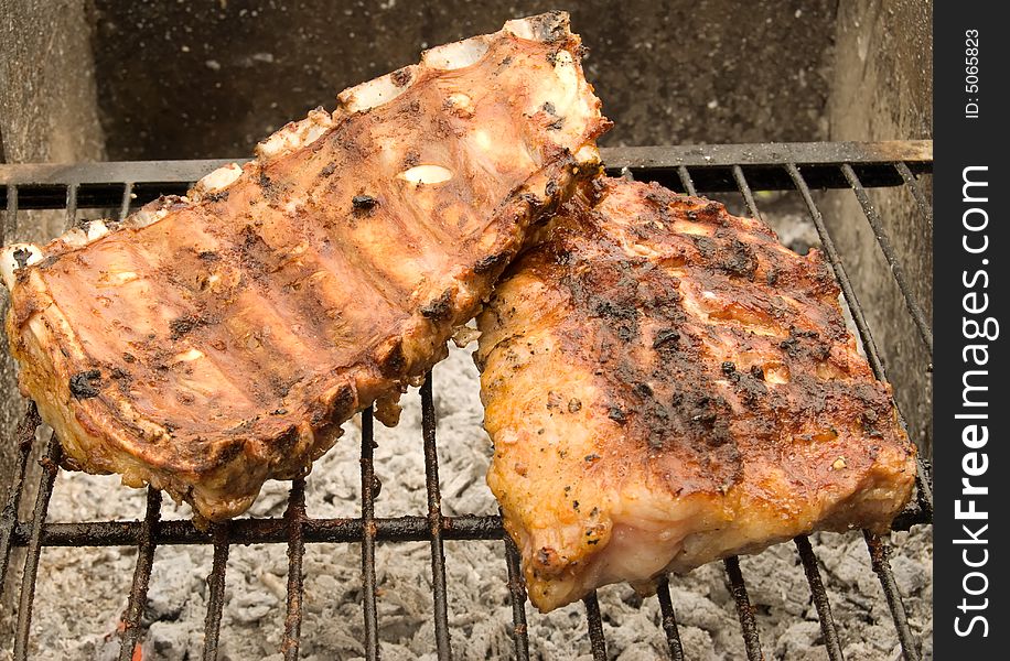 Meat grill on a grate.