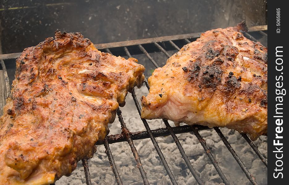 Meat grill on a grate.