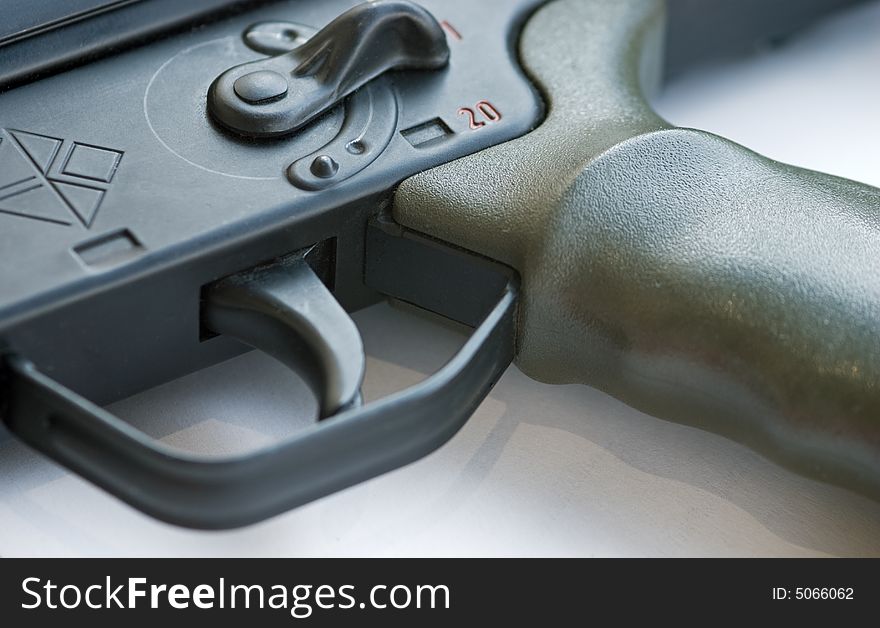 Military weapon trigger isolated on a white background