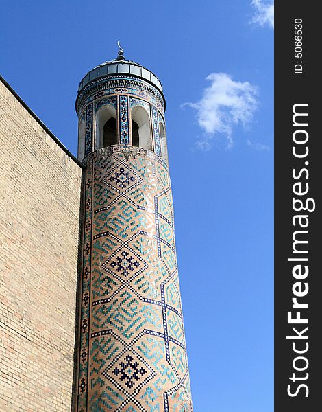 The minaret in Tashkent on the sky background