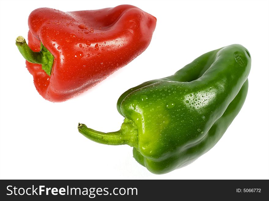 Red and green paprika on white background. Red and green paprika on white background