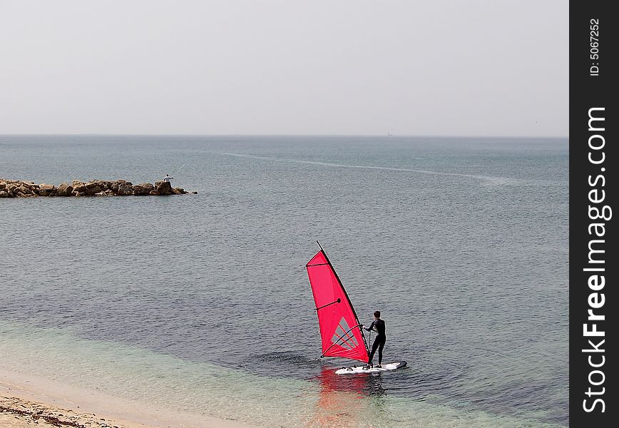 Windsurfing in the sea bay