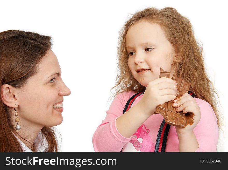 The little girl does not wish to share chocolate. The little girl does not wish to share chocolate