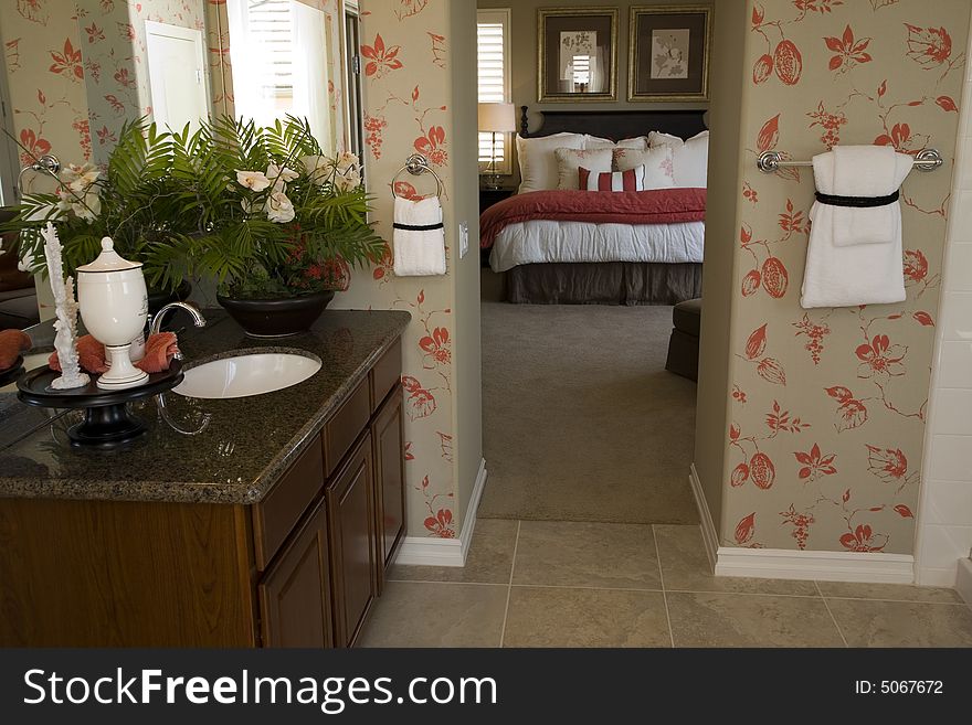 Designer bathroom with a modern tub and tile floor. Designer bathroom with a modern tub and tile floor.