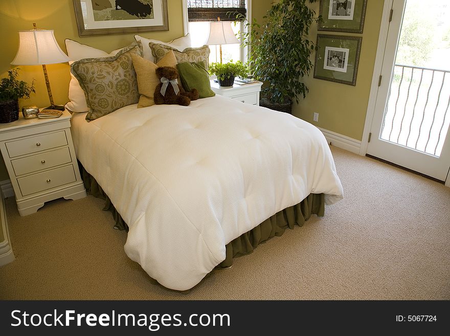 Designer bedroom with contemporary furniture and decor. Designer bedroom with contemporary furniture and decor.