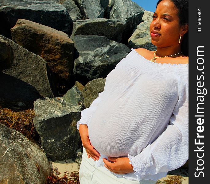 African American Woman by the rocks