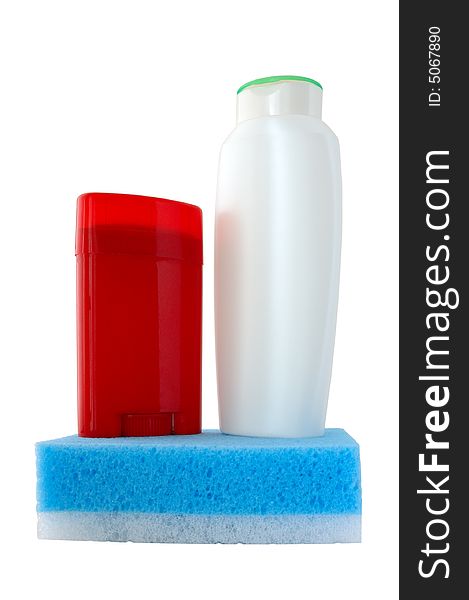 Bath collection. Red deodorant, white shower-gel (or shampoo) and blue sponge.