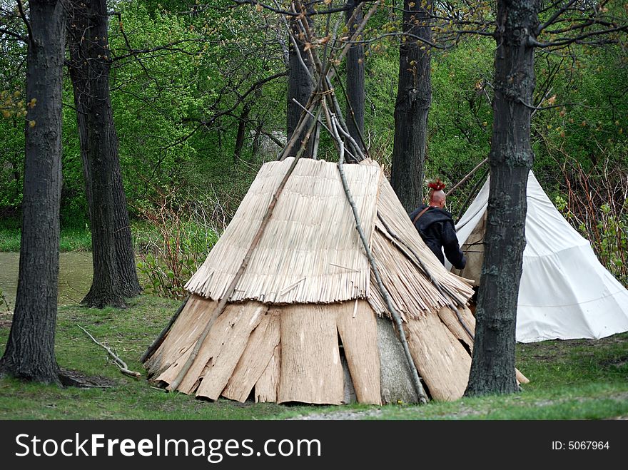 Indian tepees in the woods. Indian tepees in the woods.